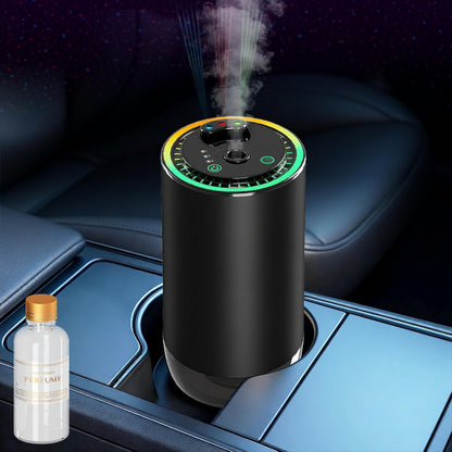 Black humidifier emitting mist on a car console with a bottle of perfume next to it.
