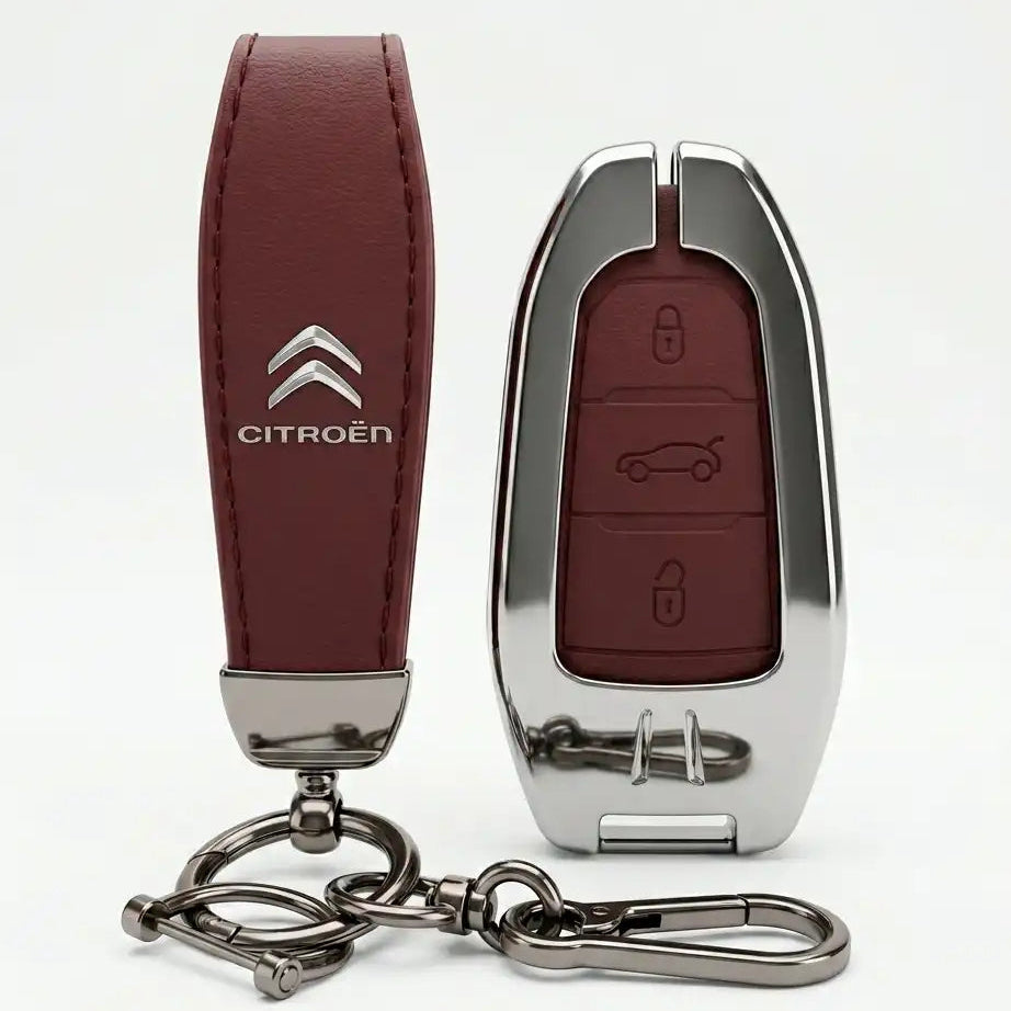 Car key fob with brown leather cover and Citroén logo on a white background