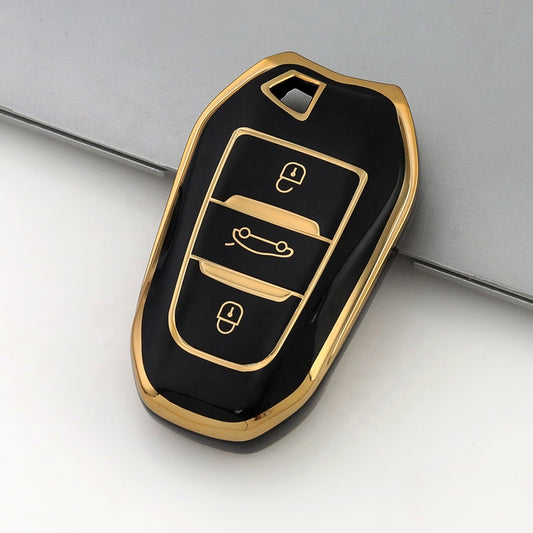 Black and gold car key fob cover on a light gray background