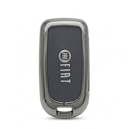 A Fiat key fob cover or decorative shell with a dark textured center panel and polished silver metallic border, shown on a plain white background.