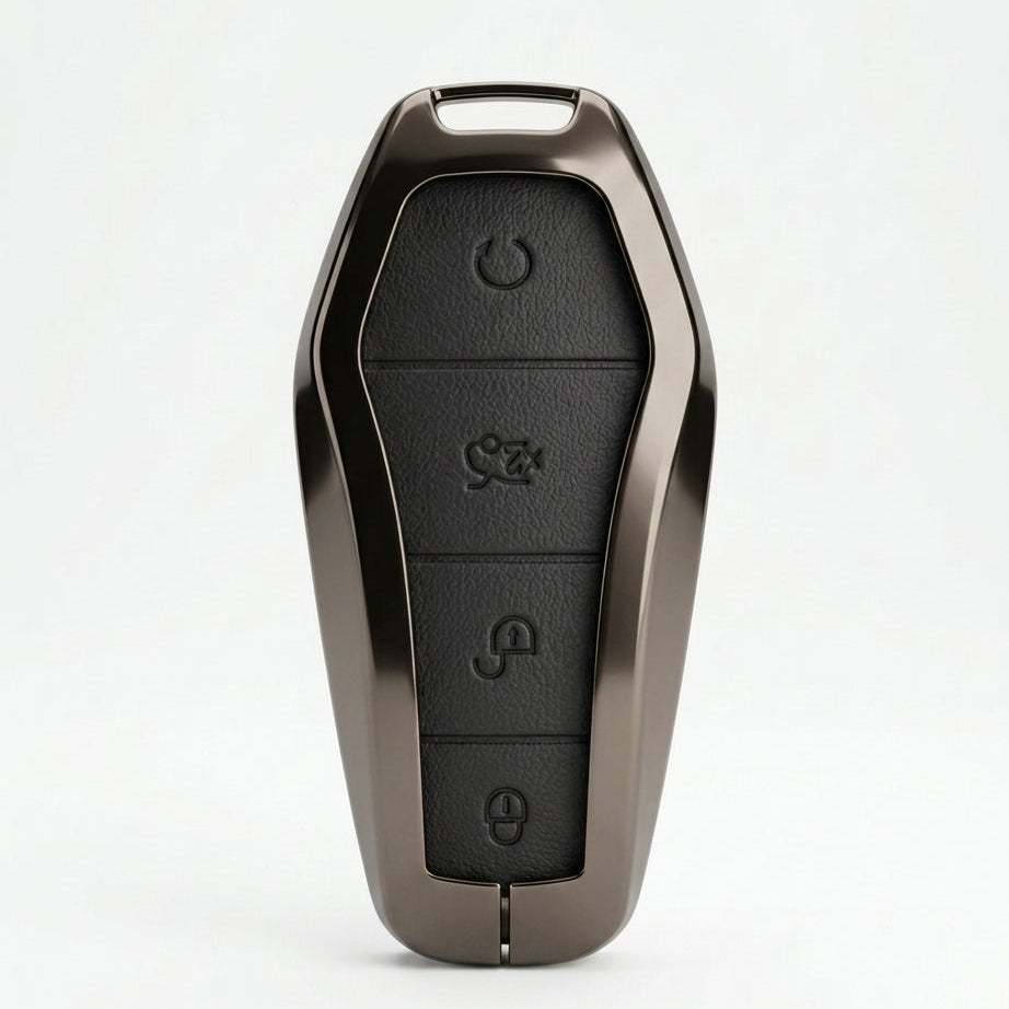 A custom metallic bronze key fob case with a black textured button panel, shown on a clean white background.