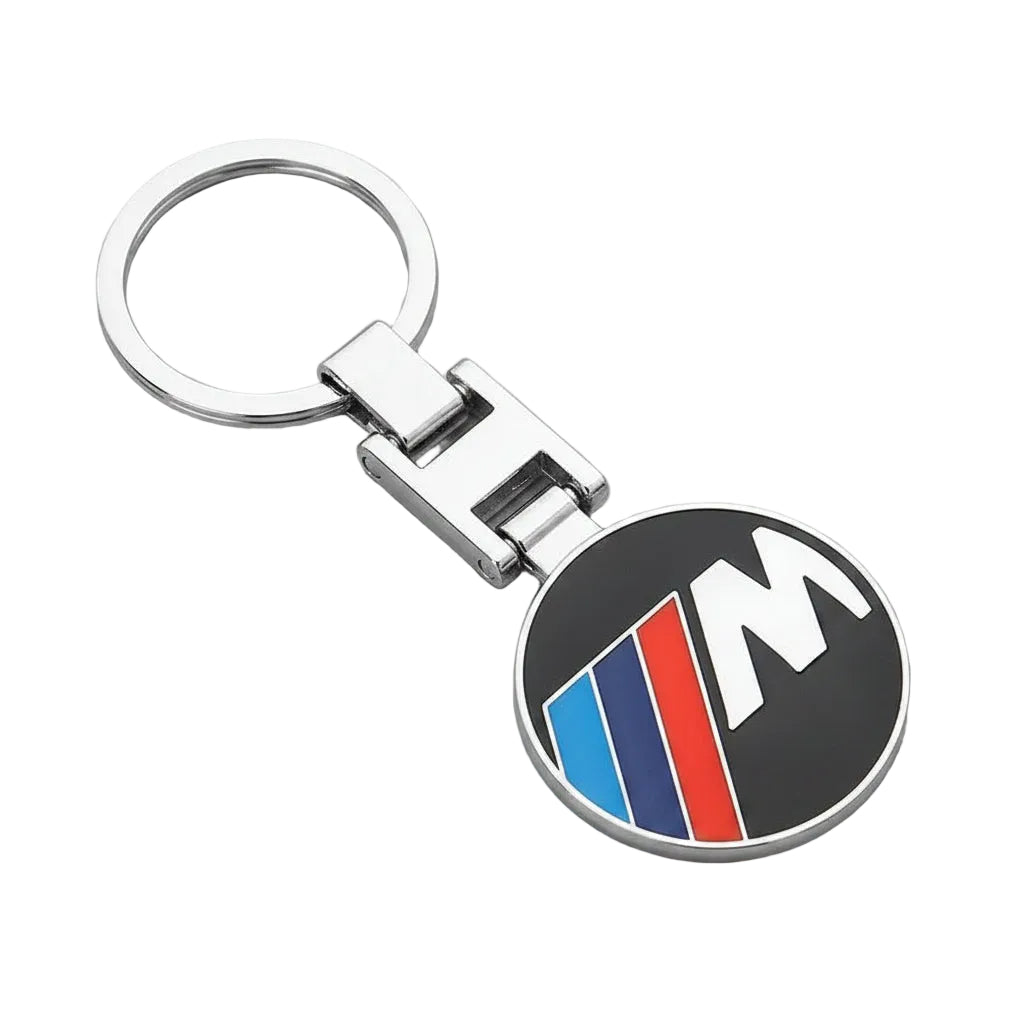 Keychain with BMW M logo on a dark background