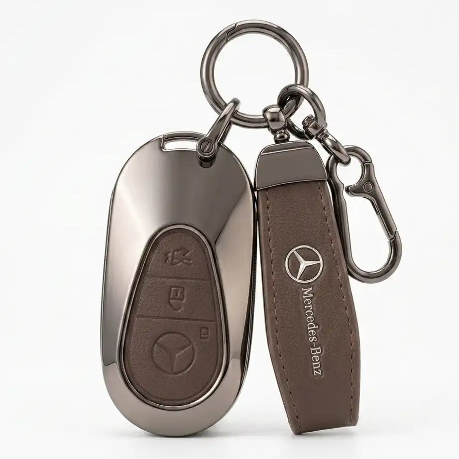 Key fob and leather strap with Mercedes-Benz logo on a white background