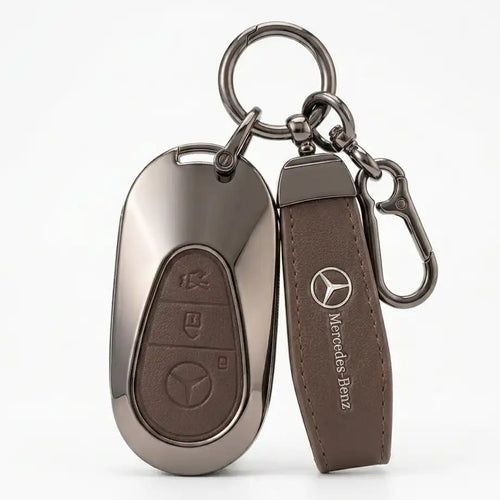 Key fob and leather strap with Mercedes-Benz logo on a white background