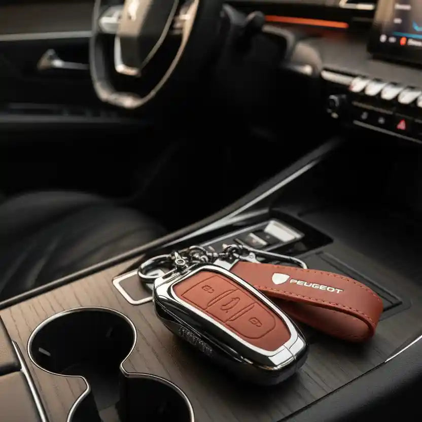 Car key fob with brown leather cover on car dashboard