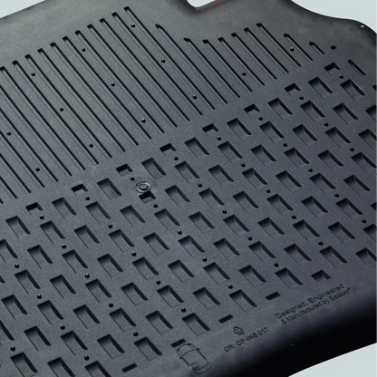 Black rubber mat with textured surface on a light gray background