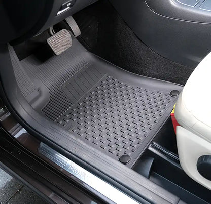 Car floor mat with brand logo on a vehicle interior