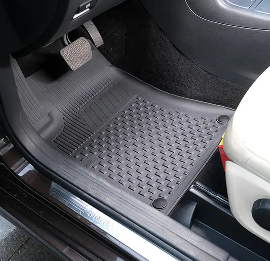 Car floor mat with brand logo on a vehicle interior
